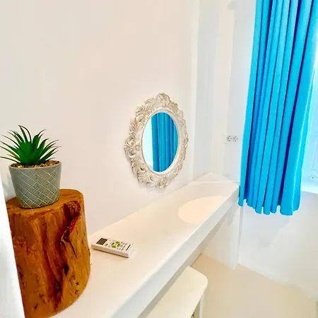 Aphrodite Next To The Windmills Of Mykonos