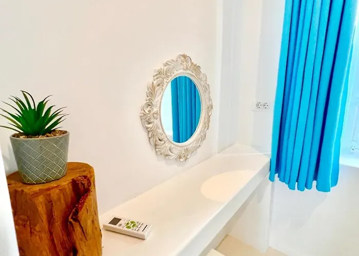 Aphrodite Next To The Windmills Of Mykonos